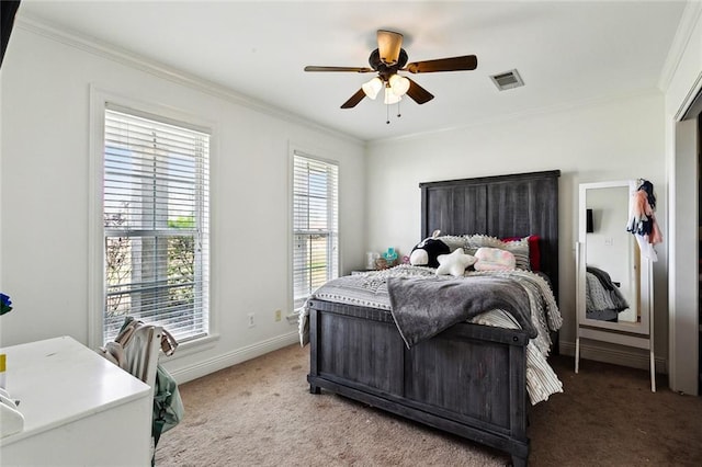 bedroom with ornamental molding, carpet, and ceiling fan