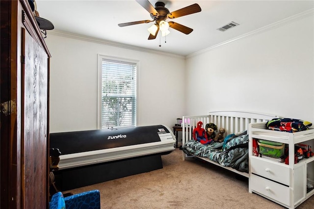 carpeted bedroom with crown molding and ceiling fan