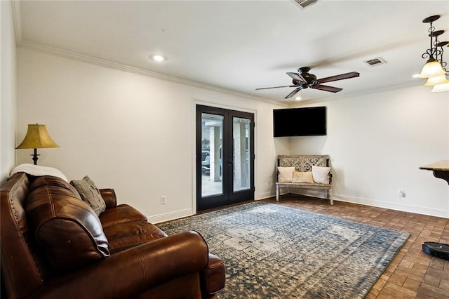 living room featuring crown molding, french doors, and ceiling fan