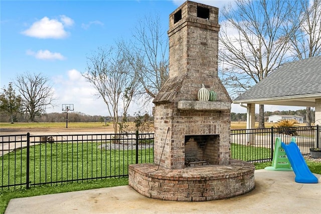 view of patio / terrace featuring an outdoor brick fireplace and a gazebo