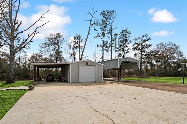 exterior space with a garage, an outdoor structure, a yard, and a carport