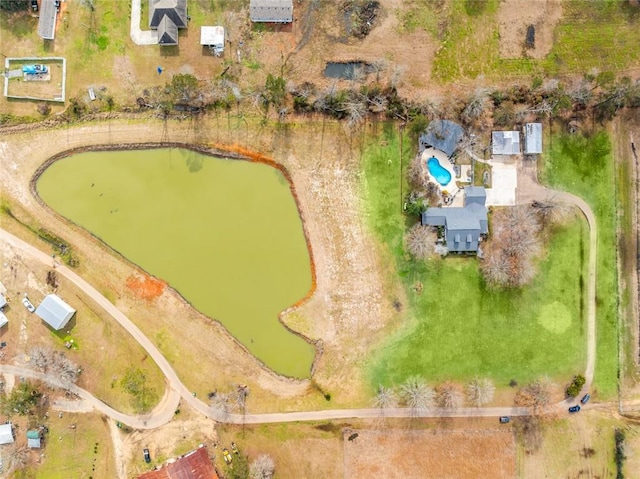 birds eye view of property with a water view