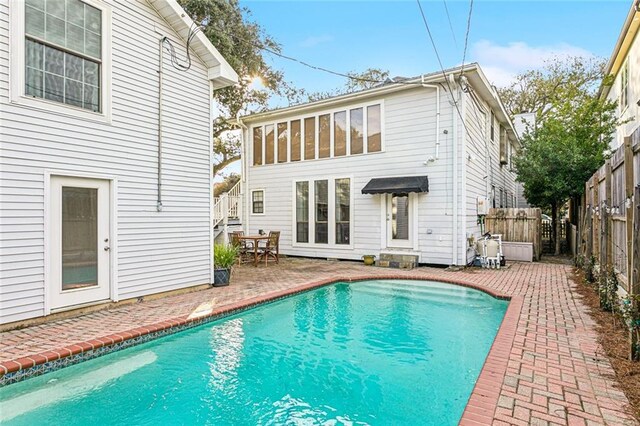 rear view of house with a patio