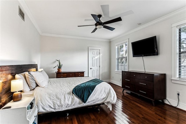 bedroom with dark wood-type flooring, ceiling fan, and crown molding