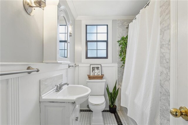 full bathroom featuring tile patterned floors, toilet, ornamental molding, vanity, and shower / bath combination with curtain