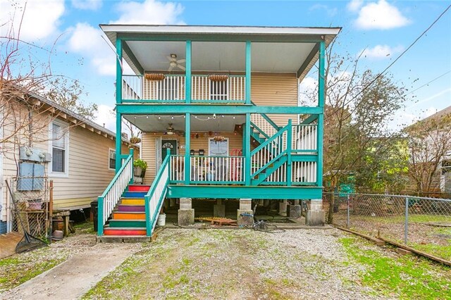 view of front of house with a balcony, covered porch, and ceiling fan