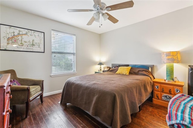 bedroom with ceiling fan and dark hardwood / wood-style flooring