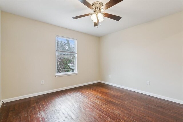 unfurnished room with cooling unit, ceiling fan, and dark hardwood / wood-style floors