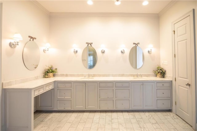 bathroom with crown molding and vanity