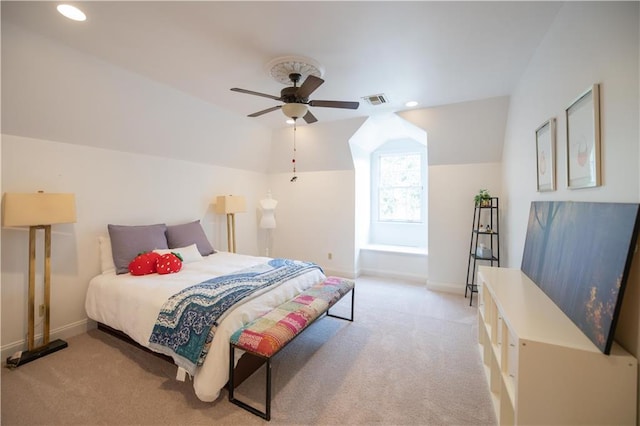 carpeted bedroom featuring vaulted ceiling and ceiling fan