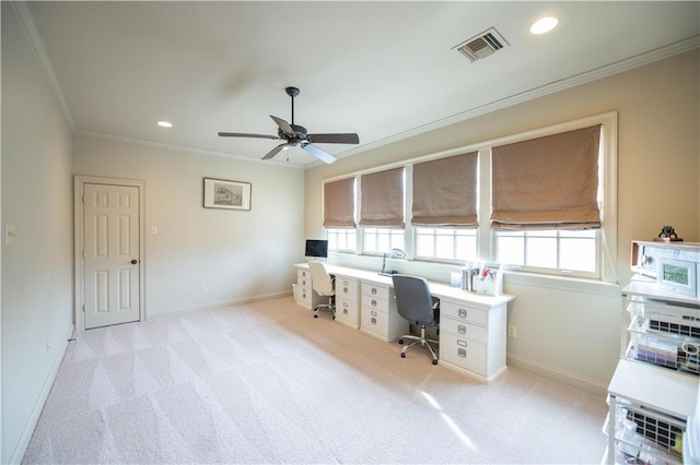 office space featuring crown molding, light carpet, and ceiling fan