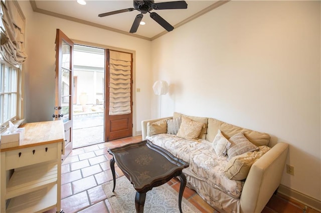 living room with crown molding and ceiling fan