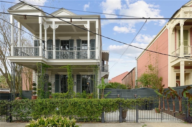 view of front of home with a balcony and a porch