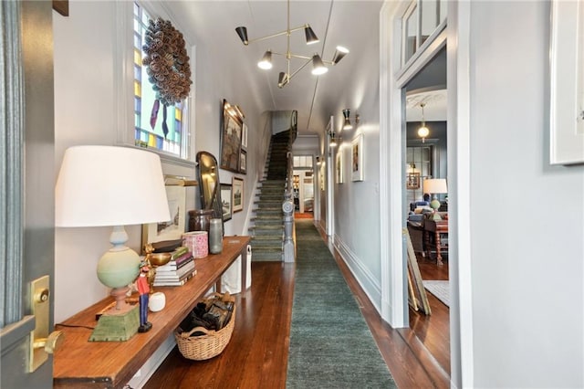 hallway with dark hardwood / wood-style floors