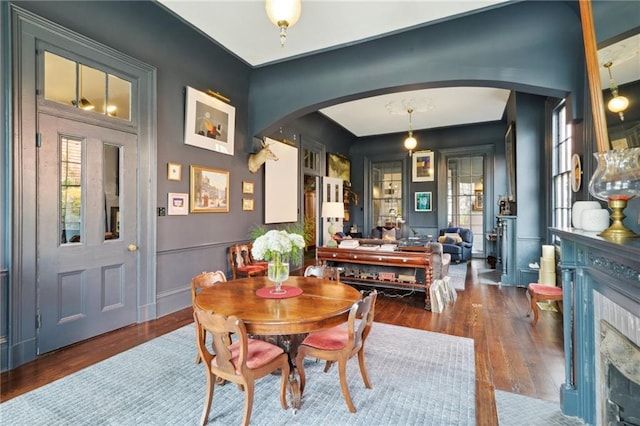 dining area with dark hardwood / wood-style flooring