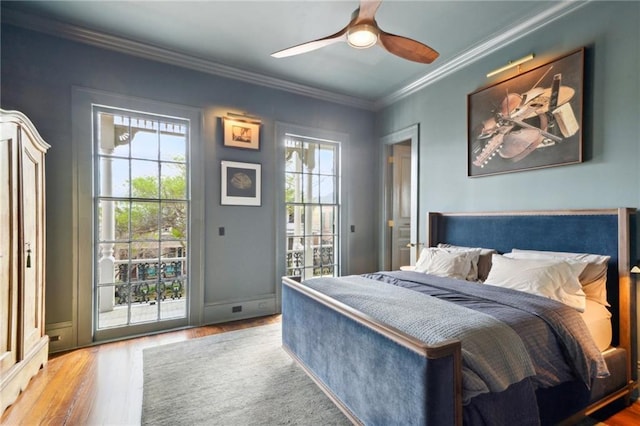 bedroom with access to exterior, crown molding, ceiling fan, and hardwood / wood-style flooring