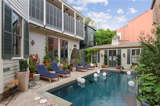 view of swimming pool featuring a patio area