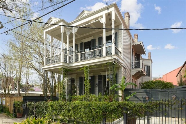 1013 Race St, New Orleans, LA 70130 - view of side of home featuring a balcony and covered porch
