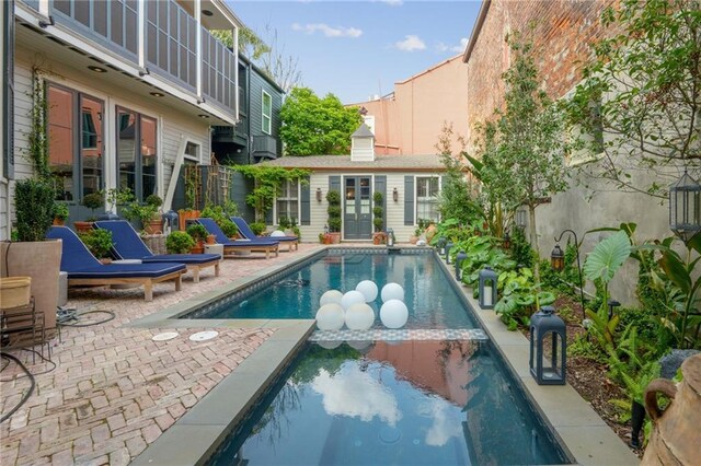 1013 Race St, New Orleans, LA 70130 - view of pool with a patio and an outbuilding