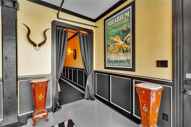 interior details featuring concrete flooring and ornamental molding