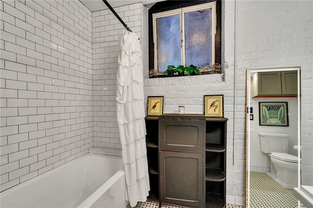 bathroom featuring shower / tub combo, tile patterned flooring, and toilet