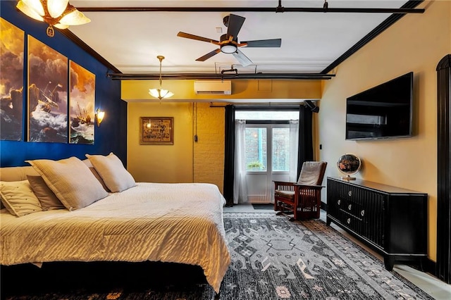 bedroom with crown molding and a wall mounted AC