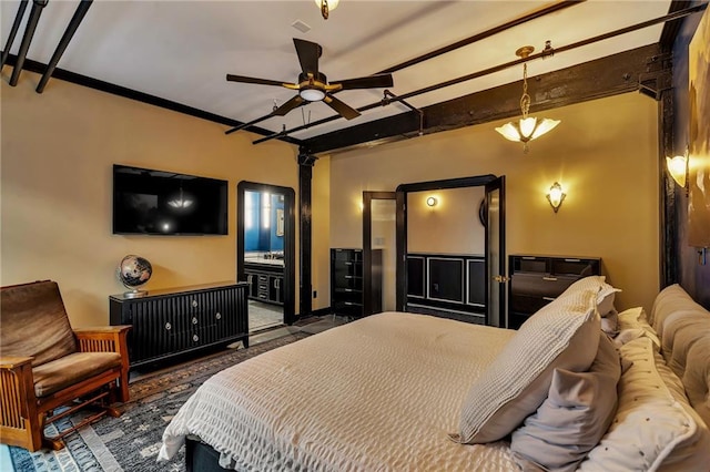 bedroom featuring ornamental molding, connected bathroom, and beam ceiling