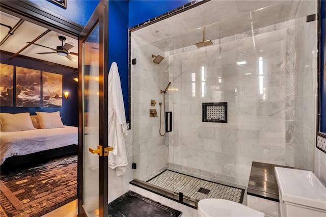 bathroom with an enclosed shower and ceiling fan