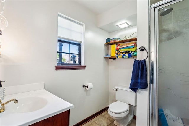 bathroom featuring vanity, a shower with shower door, tile patterned floors, and toilet