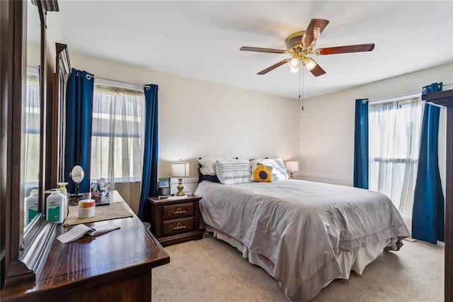 carpeted bedroom featuring ceiling fan