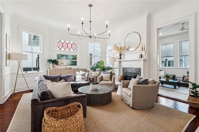 living room featuring an inviting chandelier and hardwood / wood-style floors