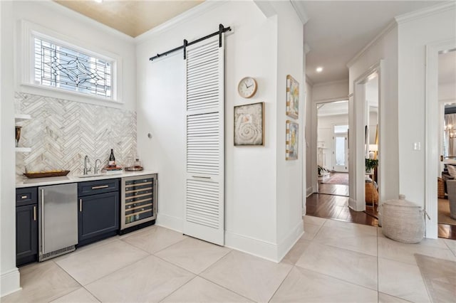 bar with stainless steel fridge, light tile patterned flooring, beverage cooler, and crown molding