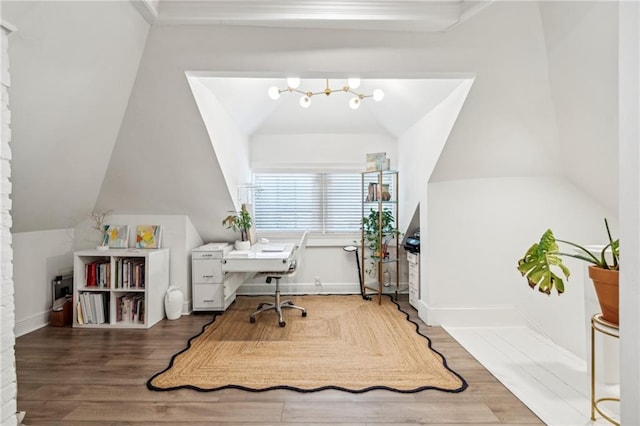 home office with hardwood / wood-style floors, vaulted ceiling, and a chandelier