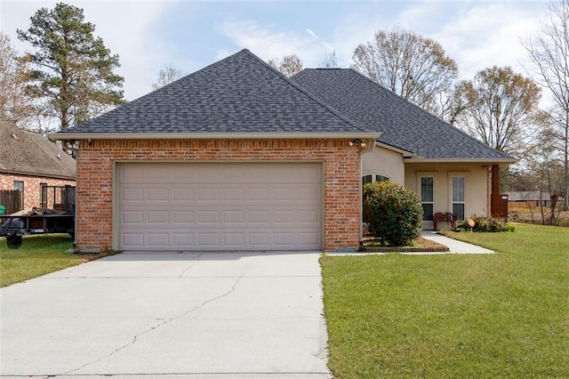 view of front of property with a garage and a front lawn