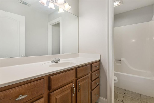 full bathroom featuring tile patterned floors, toilet, shower / bath combination, and vanity