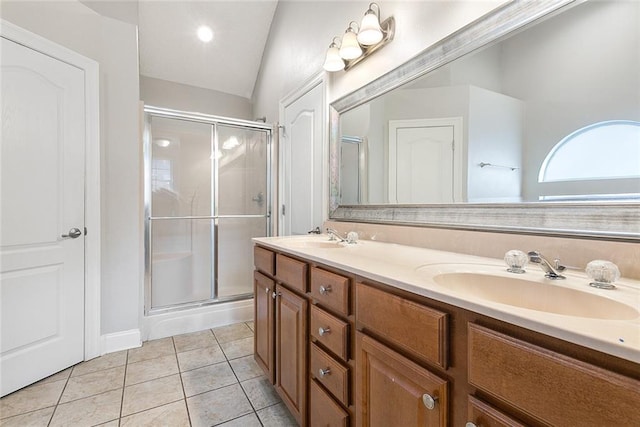 bathroom featuring lofted ceiling, tile patterned floors, an enclosed shower, and vanity