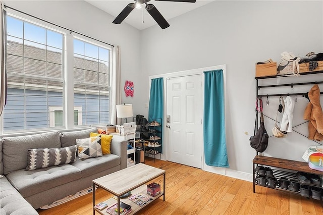 living room featuring hardwood / wood-style flooring and ceiling fan