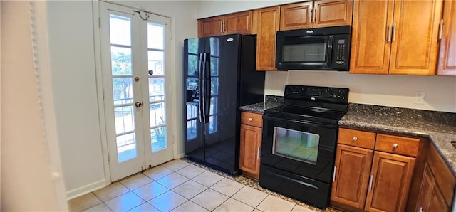 kitchen featuring brown cabinetry, french doors, light tile patterned flooring, and black appliances