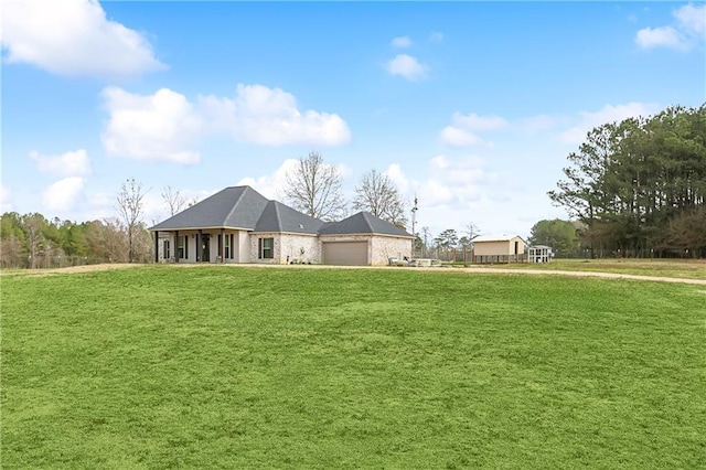 71078 Troy Spears Rd, Kentwood, LA 70444 - view of front facade with an attached garage and a front lawn