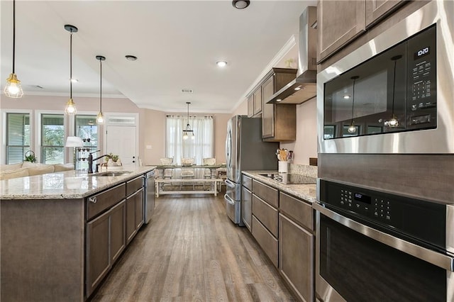 71078 Troy Spears Rd, Kentwood, LA 70444 - kitchen with wall chimney exhaust hood, ornamental molding, a sink, appliances with stainless steel finishes, and wood finished floors