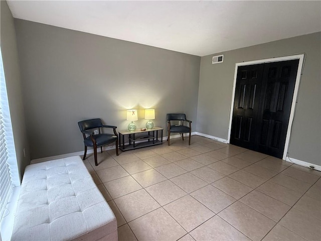 sitting room with light tile patterned flooring