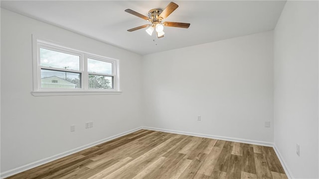 spare room featuring ceiling fan and light wood-type flooring