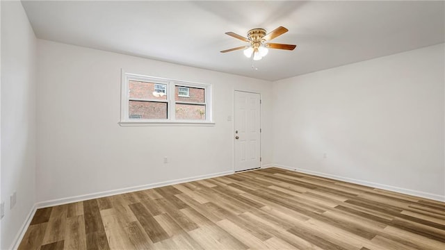 spare room with ceiling fan and light hardwood / wood-style floors