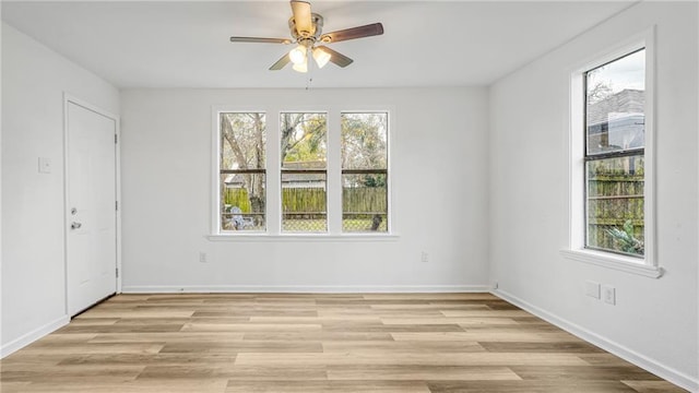 unfurnished room with light hardwood / wood-style flooring and ceiling fan