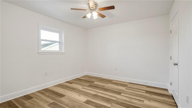 spare room featuring ceiling fan and light wood-type flooring