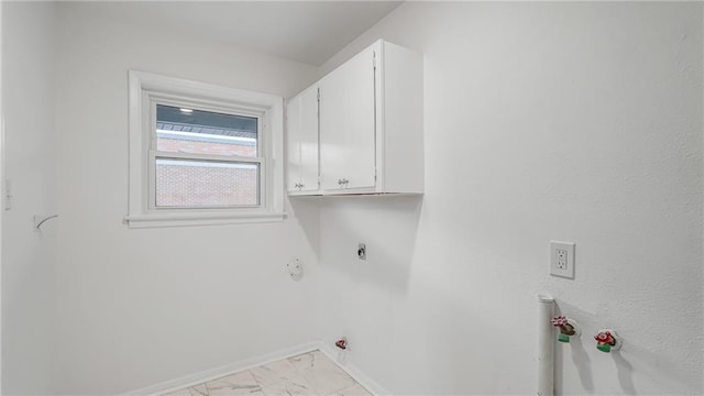 laundry room with cabinets and gas dryer hookup