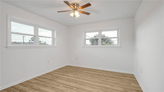 empty room with ceiling fan and light wood-type flooring