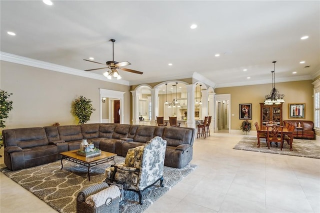 tiled living room featuring crown molding, ceiling fan with notable chandelier, and decorative columns