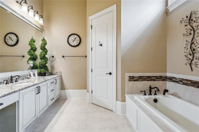 bathroom with tile patterned flooring, vanity, and a bathtub