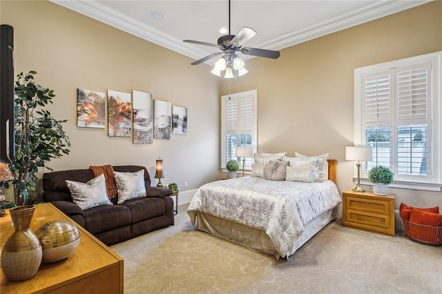 carpeted bedroom with crown molding and ceiling fan